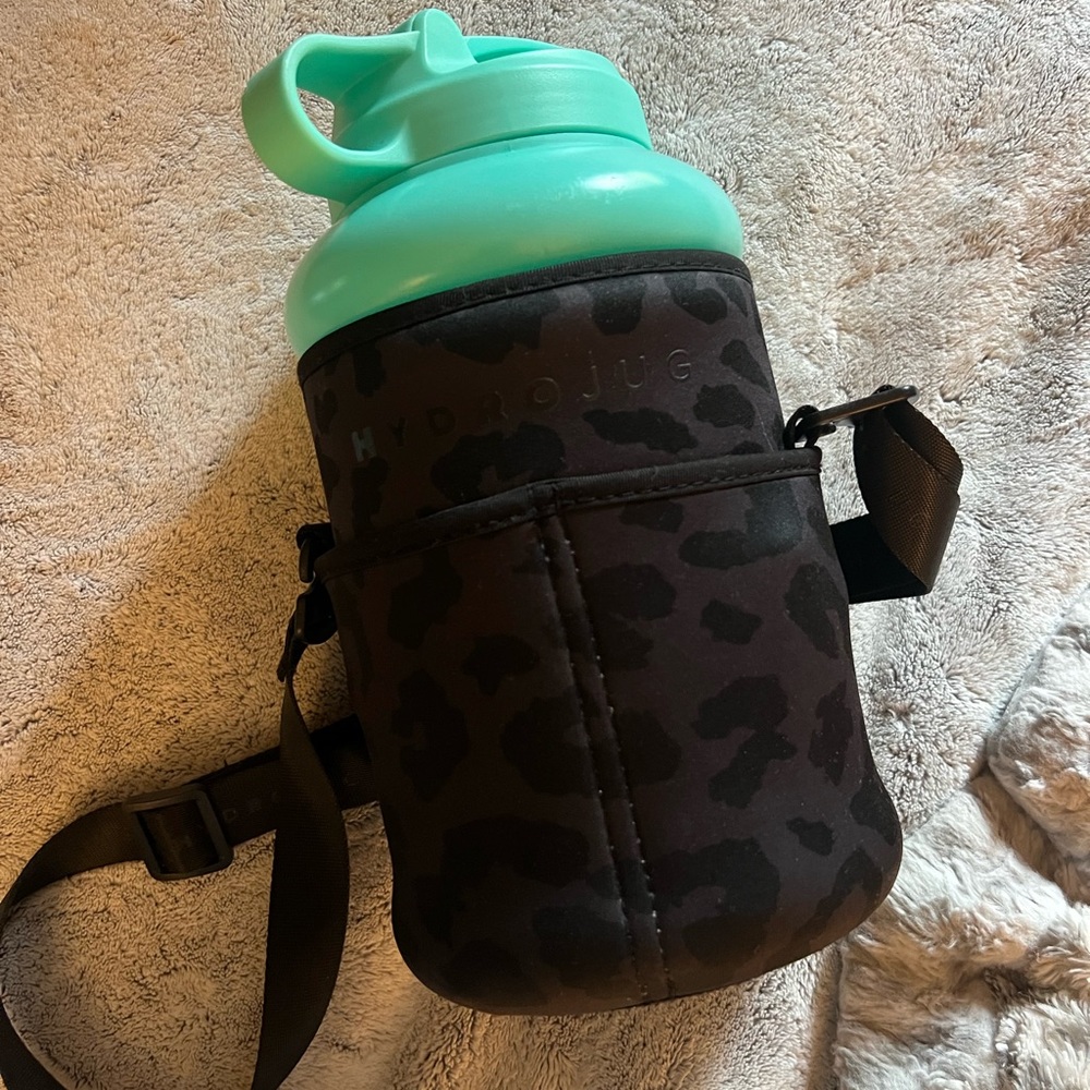 Teal hydrojug and black leopard sleeve